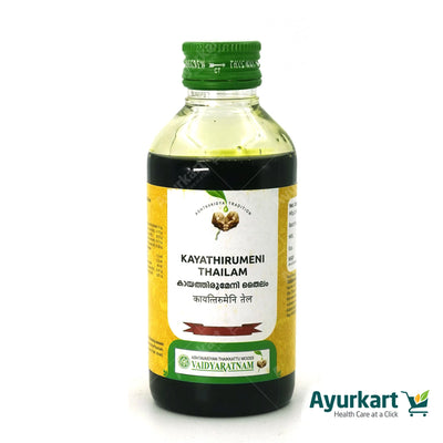 VAIDYARATNAM KAYATHIRUMENI THAILAM being applied to an ankle for pain relief.