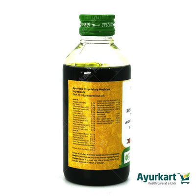 VAIDYARATNAM KAYATHIRUMENI THAILAM being applied to an ankle for pain relief.