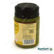 Applying Kottakkal Mahatraiphala Ghritam for eye care