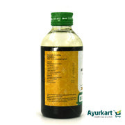 A person using Vaidyaratnam Murivenna for pain relief and faster recovery